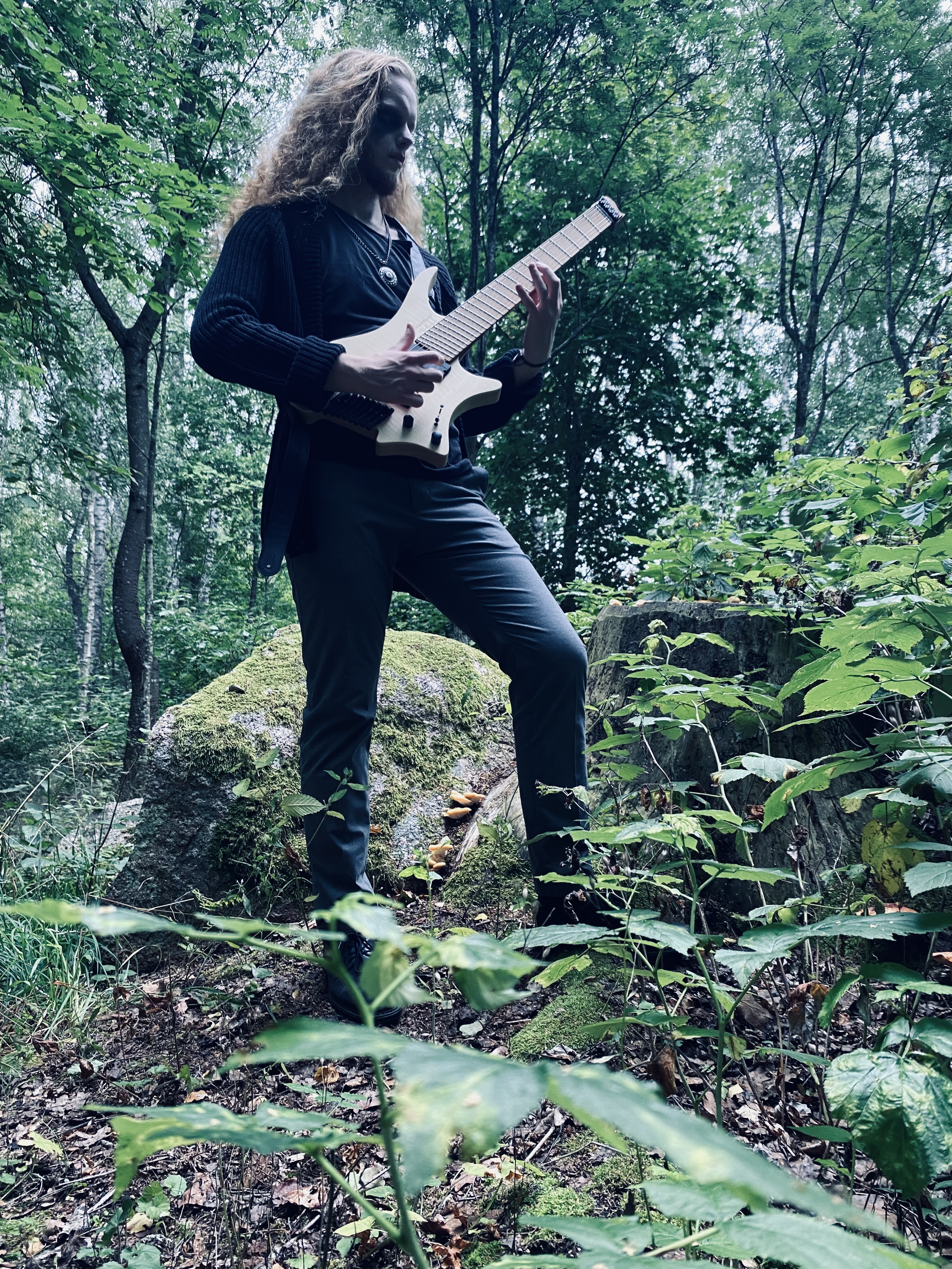 Guitarist in a forest